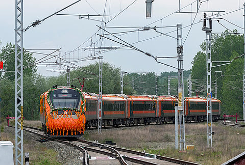 A Vande Bharat Express train moves on railway tracks during its flagging-off ceremony, it is the first direct train between Jammu and Srinagar.