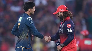 File/AP : Gujarat Titans' captain Shubman Gill and Royal Challengers Bengaluru's captain Rajat Patidar shake hands before their Indian Premier League match in Ahmedabad.