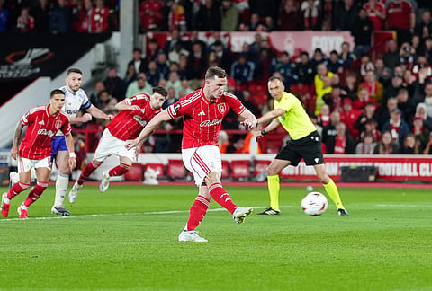 Nottingham Forest's Chris Wood scores their side's first goal from a penalty during the Europa League semifinal first leg soccer match between Nottingham Forest and Aston Villa in Nottingham, England.