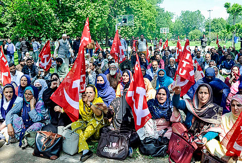 Anganwadi and ASHA workers take part in a sit-in protest organised by Centre of Indian Trade Unions (CITU) over various pending issues on International Labour Day, also known as May Day, in Srinagar, Jammu and Kashmir.