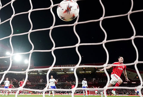 Nottingham Forest's Chris Wood celebrates scoring their side's first goal from a penalty kick during the Europa League semifinal first leg soccer match between Nottingham Forest and Aston Villa in Nottingham, England.