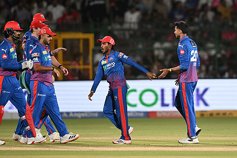 Delhi Capitals' captain Axar Patel, right, celebrates the wicket of Rajasthan Royals' Dhruv Jurel with teammates during the Indian Premier League cricket match between Delhi Capitals and Rajasthan Royals in Jaipur.