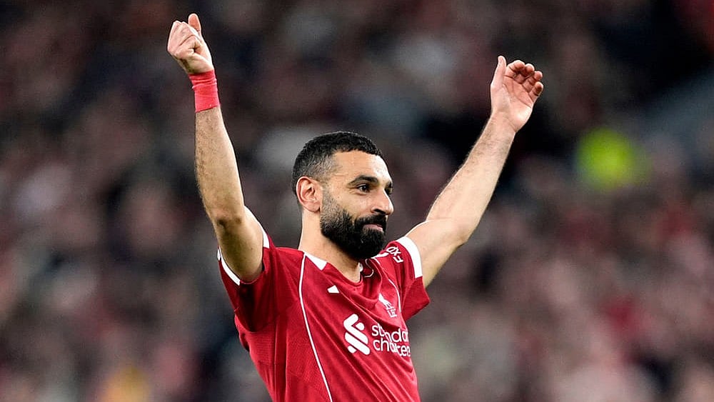 Liverpool's Mohamed Salah celebrates scoring his side's fourth goal  during the second leg of the Champions League round of 16 soccer match between Liverpool and Galatasaray, in Liverpool, England. - | Photo: AP/Jon Super
