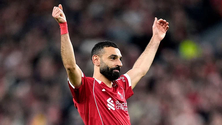 Liverpool's Mohamed Salah celebrates scoring his side's fourth goal during the second leg of the Champions League round of 16 soccer match between Liverpool and Galatasaray, in Liverpool, England. - | Photo: AP/Jon Super