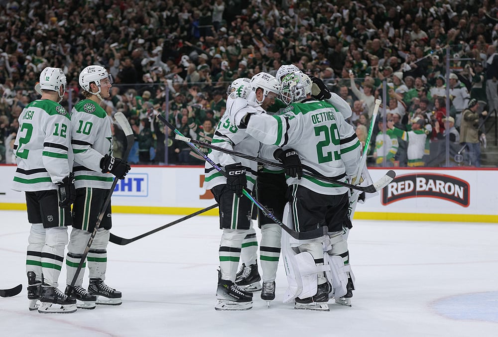Dallas Stars goaltender Jake Oettinger (29) is greeted by teammates after they lost Game 6 in the first round of the NHL hockey Stanley Cup playoff series against the Minnesota Wild, in St. Paul, Minnesota. - | Photo: AP/Bailey Hillesheim