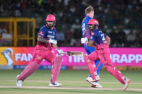 Rajasthan Royals' Dhruv Jurel with batting partner captain Riyan Parag run between the wickets to score during the Indian Premier League cricket match between Delhi Capitals and Rajasthan Royals in Jaipur, India.