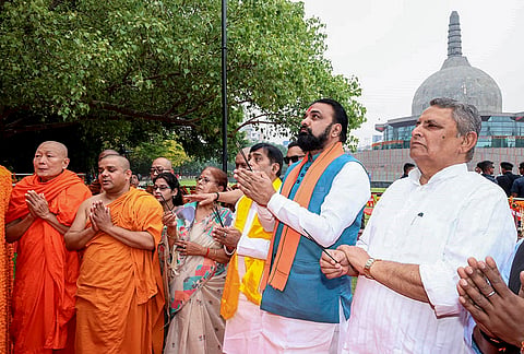 Bihar Chief Minister Samrat Choudhary along with state Deputy CM Vijay Kumar Choudhary, right, and others offer prayers on 'Buddha Purnima', at Buddha Smriti Park, in Patna.