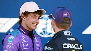 AP Photo : Mercedes driver Kimi Antonelli of Italy talks with Red Bull driver Max Verstappen of the Netherlands after a qualifying session for the Miami Formula One Grand Prix auto race.