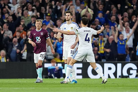 Leeds United's Anton Stach, centre, celebrates scoring their side's first goal during the Premier League match between Leeds United and Burnley, in Leeds, England.