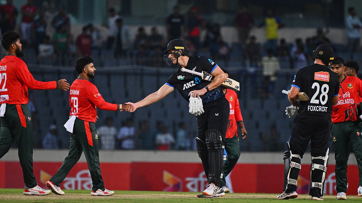 New Zealand's Bevon Jacobs shakes hands with Bangladesh's players after winning the third T20 international cricket match between Bangladesh and New Zealand in Mirpur, Bangladesh, Saturday, May 2, 2026 - (AP Photo/Mosaraf Hossain)