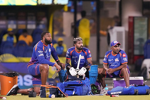 Mumbai Indians' captain Hardik Pandya, centre, with head coach Mahela Jayawardene, right, and batting coach Kieron Pollard during a training session ahead of an Indian Premier League (IPL) 2026 T20 cricket match between Chennai Super Kings and Mumbai Indians, in Chennai, Tamil Nadu.