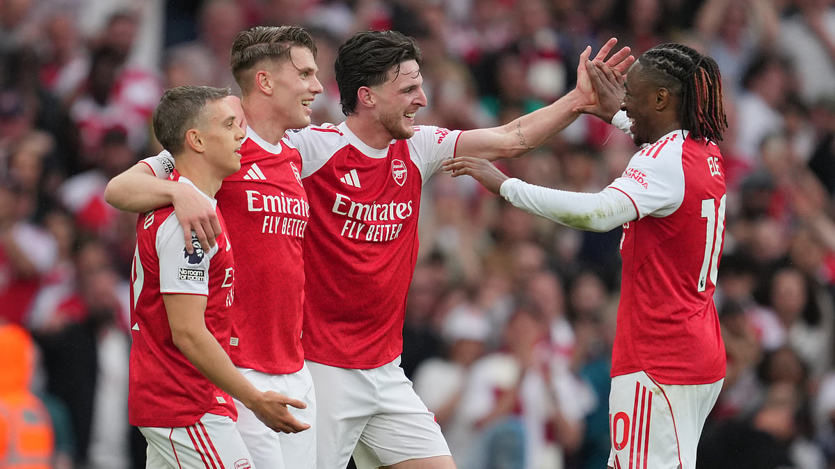 Arsenal's Viktor Gyoekeres, second left, celebrates with Arsenal's Declan Rice, centre, Arsenal's Leandro Trossard, left, and Arsenal's Eberechi Eze after scoring his side's third goal during the English Premier League soccer match between Arsenal and Fulham in London.  - AP Photo