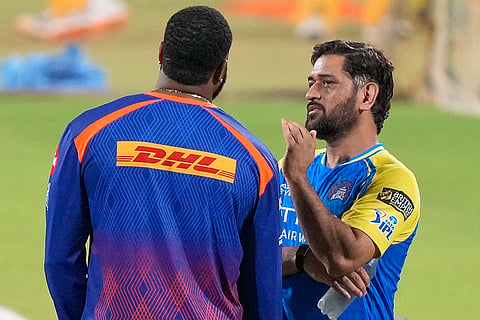 Mumbai Indians' batting coach Kieron Pollard, left, with Chennai Super Kings' MS Dhoni during a training session ahead of an Indian Premier League (IPL) 2026 T20 cricket match between Chennai Super Kings and Mumbai Indians, in Chennai, Tamil Nadu