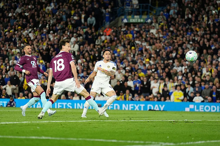 Leeds United's Noah Okafor, right, scores their side's second goal during the Premier League match between Leeds United and Burnley, in Leeds, England. - | Photo: Martin Rickett/PA via AP