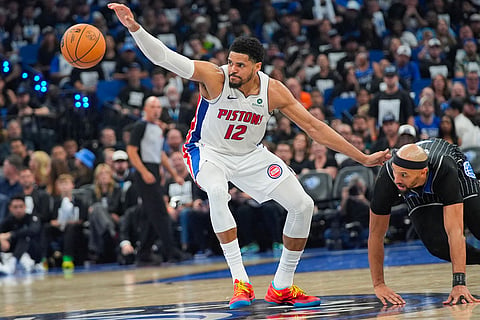 Detroit Pistons forward Tobias Harris (12) loses control of the ball in front of Orlando Magic guard Jalen Suggs, right, during the second half in Game 6 of a first-round NBA basketball playoffs series in Orlando, Fla. 
