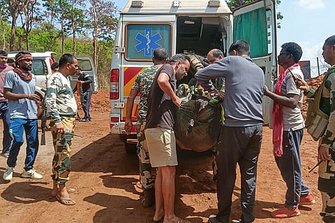Security personnel and others carry mortal remains of one of the four police personnel who were killed after an improvised explosive device (IED) went off while they were trying to neutralise it during a demining operation, in Kanker district, Chhattisgarh.