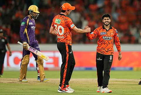 Sunrisers Hyderabad's Shivang Kumar, centre celebrates the wicket of Angkrish Raghuvanshi, left, during the Indian Premier League cricket match between Sunrisers Hyderabad and Kolkata Knight Riders in Hyderabad.
