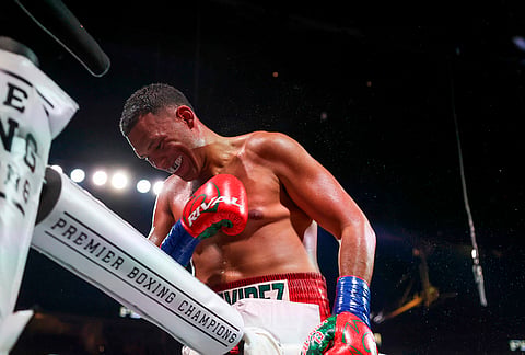 David Benavidez celebrates after his win over Gilberto Ramirez, not pictured, in a cruiserweight championship boxing match in Las Vegas. 