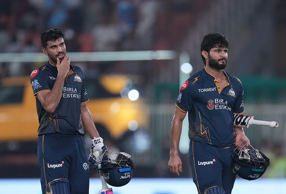 | Photo: AP/Ajit Solanki : Gujarat Titans' Washington Sundar and Arshad Khanshakes following their win during the Indian Premier League cricket match between Gujarat Titans and Punjab Kings in Ahmedabad.