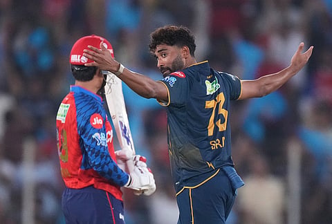 Gujarat Titans' Mohammed Siraj celebrates the wicket of Punjab Kings' Priyansh Arya during the Indian Premier League cricket match between Gujarat Titans and Punjab Kings in Ahmedabad.