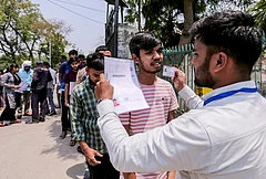 Aspirants undergo security check before appearing for the National Eligibility-cum-Entrance Test (NEET-UG) examination, in Prayagraj, Uttar Pradesh. - | Photo: PTI; Representative image