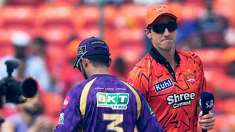Sunrisers Hyderabad's Pat Cummins, right and Kolkata Knight Riders' captain Ajinkya Rahane shake hands after the coin toss during the Indian Premier League cricket match between Sunrisers Hyderabad, India, Sunday, May 3, 2026