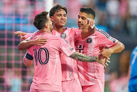 From left, Inter Miami forward Lionel Messi (10), midfielder Telasco Segovia (8) and forward Luis Suárez (9) celebrate a goal together in the first half during an MLS soccer match against the Orlando City, in Miami. 