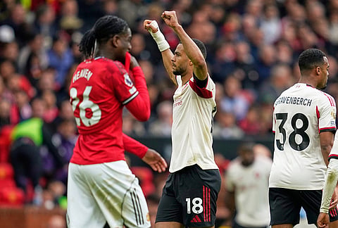 Liverpool's Cody Gakpo celebrates after scoring his side's second goal during the English Premier League soccer match between Manchester United and Liverpool in Manchester, England.