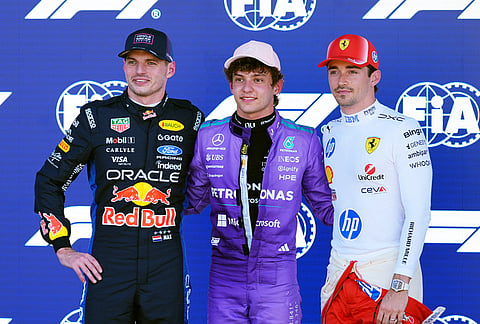 Top three qualifiers, from left, Red Bull driver Max Verstappen of the Netherlands, Mercedes driver Kimi Antonelli of Italy, and Ferrari driver Charles Leclerc of Monaco pose for a photo after a qualifying session for the Miami Formula One Grand Prix auto race, in Miami Gardens, Florida. 