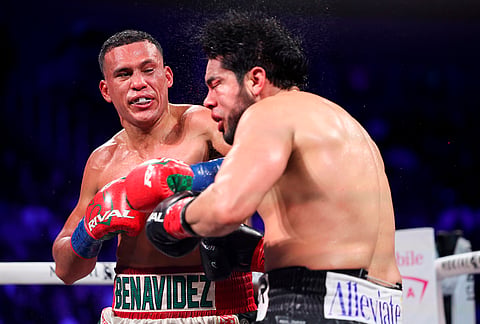 David Benavidez punches Gilberto Ramirez in a cruiserweight championship boxing match in Las Vegas. 