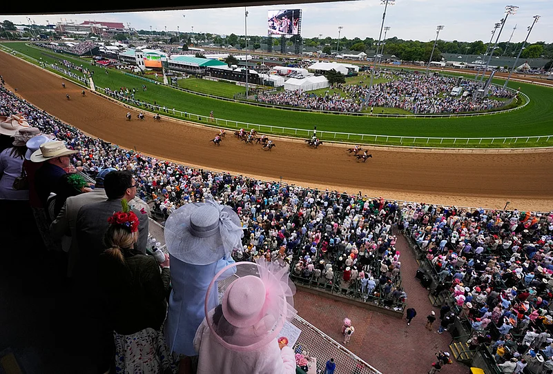 Kentucky Derby 2026 Tradition, fashion and horse racing photos-
Fans watch as Golden Tempo (19) ridden by Jose L. Ortiz wins the 152nd running of the Kentucky Derby horse race at Churchill Downs, in Louisville, Kentucky.