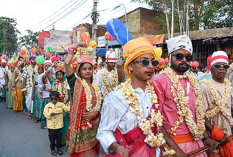 People take part during a procession as part of the 'Manda Puja' festival celebration, in Ranchi.