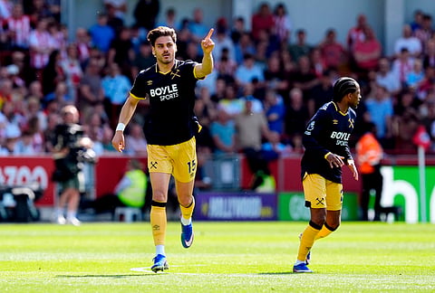 West Ham United's Konstantinos Mavropanos celebrates scoring only to see his effort ruled out by VAR during their English Premier League soccer match against Brentford in London.
