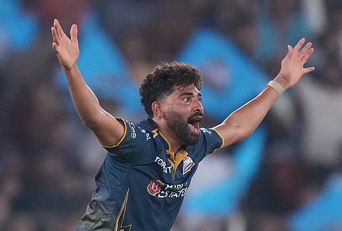 Gujarat Titans' Mohammed Siraj appeals successfully for the wicket of Punjab Kings' Cooper Connolly during the Indian Premier League cricket match between Gujarat Titans and Punjab Kings in Ahmedabad.