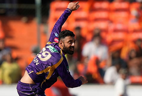 Kolkata Knight Riders' Varun Chakaravarthy bowls a delivery during the Indian Premier League cricket match between Sunrisers Hyderabad and Kolkata Knight Riders in Hyderabad.