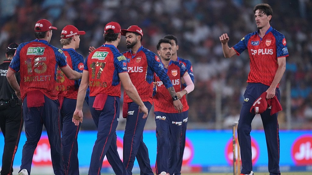Marco Jansen, right, celebrates the wicket of Rahul Tewatia with teammates during the Indian Premier League match between Gujarat Titans and Punjab Kings in Ahmedabad. - AP/Ajit Solanki