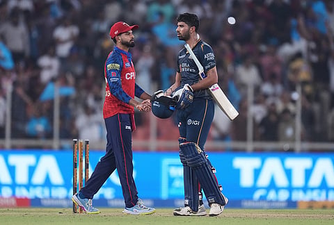 Gujarat Titans' Washington Sundar shakes hands with Punjab Kings' captain Shreyas Iyer following their win during the Indian Premier League cricket match between Gujarat Titans and Punjab Kings in Ahmedabad.