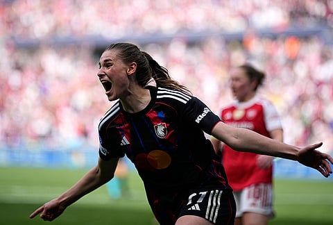 Lyonnes' Jule Brand celebrates after scoring her side's third goal during the Women's Champions League semifinal, second leg, soccer match between OL Lyonnes and Arsenal, in Decines, outside Lyon, France.