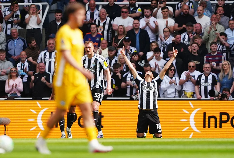 Newcastle United's William Osula celebrates scoring their side's first goal of the game during their English Premier League soccer match against Brighton & Hove Albion in Newcastle, England. - | Photo: Owen Humphreys/PA via AP