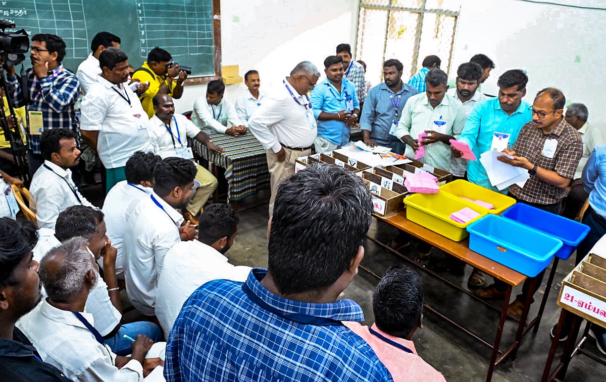 Poll officials during the counting of votes for the Puducherry Assembly elections at a counting centre, in Puducherry. - PTI