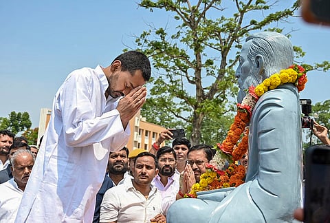 JD(U) leader Nishant Kumar pays tribute to the statue of Maharshi Valmiki during the 'Sadbhav Yatra', in West Champaran district, Bihar.