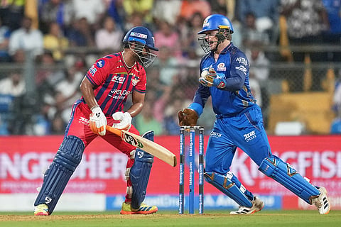 Mumbai Indians' Ryan Rickelton, right, celebrates after taking the catch of Lucknow Super Giants' captain Rishabh Pant during the Indian Premier League cricket match between Mumbai Indians and Lucknow Super Giants in Mumbai, India.