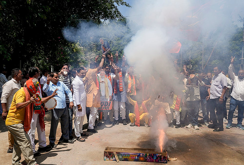 BJP supporters celebrate during vote counting