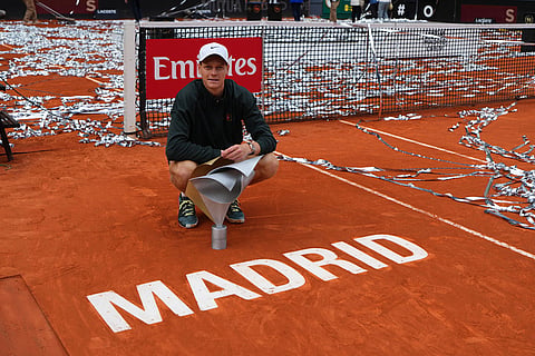 Jannik Sinner, of Italy, poses for photographers after winning the men's singles tennis final match against Alexander Zverev, of Germany, at the Madrid Open tennis tournament in Madrid, Spain.