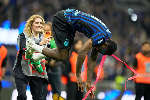 Inter Milan's Marcus Thuram celebrates their victory at the Serie A soccer match between Inter Milan and Parma, in Milan, Italy.