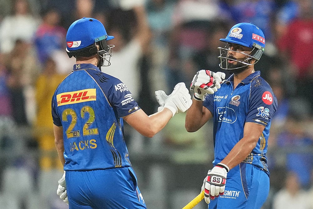 | Photo: AP/Rafiq Maqbool : Mumbai Indians' Will Jack, left, and Naman Dhir celebrate their win during the Indian Premier League cricket match between Mumbai Indians and Lucknow Super Giants in Mumbai, India.