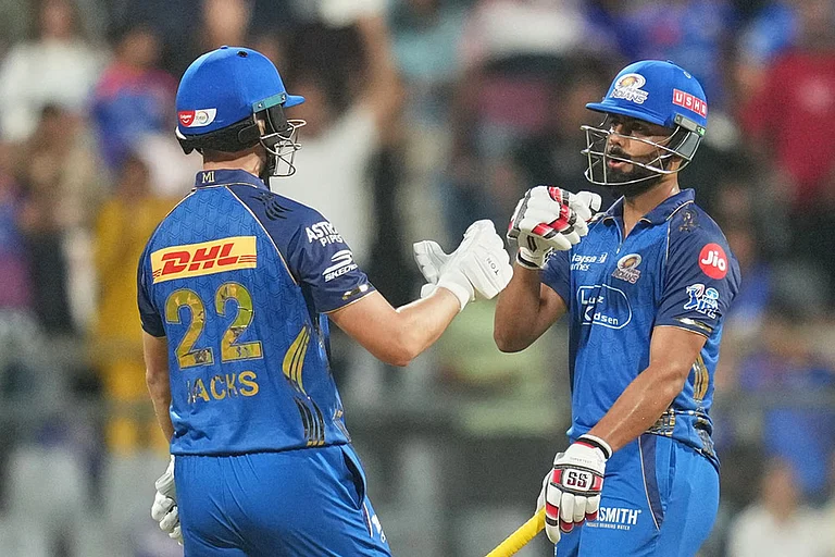 Mumbai Indians' Will Jack, left, and Naman Dhir celebrate their win during the Indian Premier League cricket match between Mumbai Indians and Lucknow Super Giants in Mumbai, India. - | Photo: AP/Rafiq Maqbool