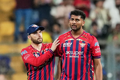 Lucknow Super Giants' Mohsin Khan, right, celebrates with teammates the wicket of Mumbai Indians' Ryan Rickelton during the Indian Premier League cricket match between Mumbai Indians and Lucknow Super Giants in Mumbai, India.