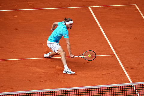 Alexander Zverev, of Germany, returns the ball to Jannik Sinner, of Italy, during their men's singles tennis final match at the Madrid Open tennis tournament in Madrid, Spain.