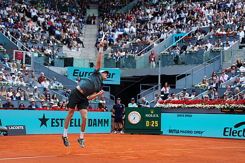 Jannik Sinner, of Italy, serves the ball to Alexander Zverev, of Germany, during their men's singles tennis final match at the Madrid Open tennis tournament in Madrid, Spain.